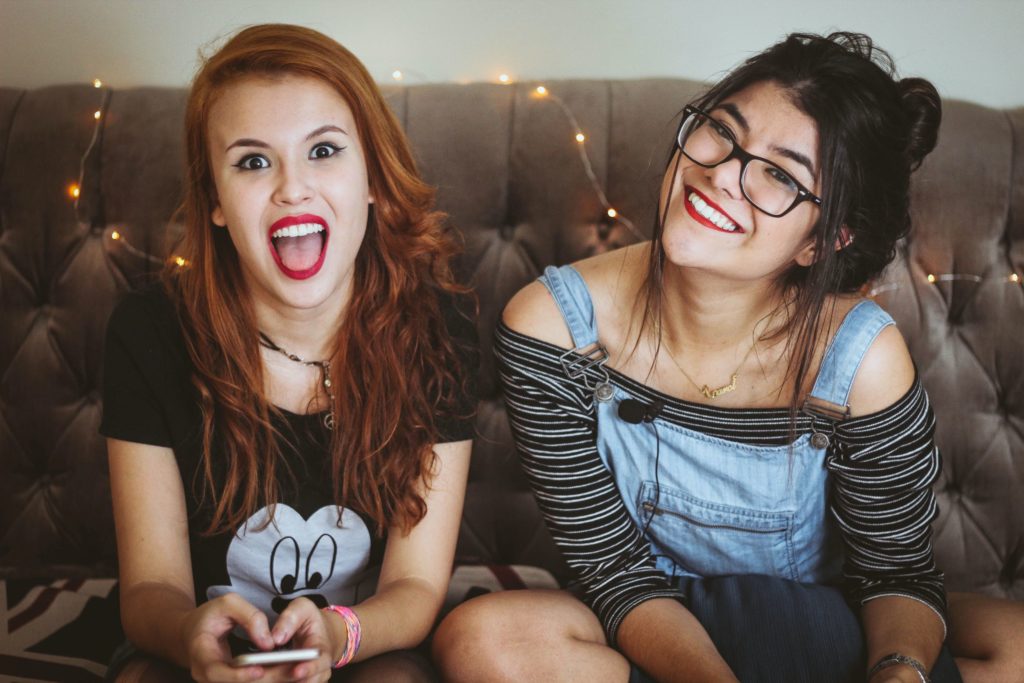 Two happy, smiling teen girls